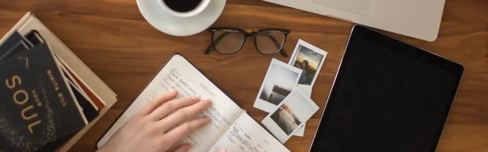 laptop-coffee-books-glasses-photos-notes-in-journal